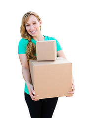 Image showing Smiling Young Adult Woman Holding Moving Boxes Isolated On A Whi