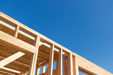 Image showing Wood Home Framing Abstract At Construction Site.