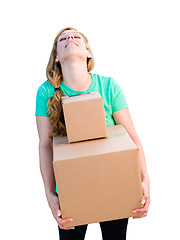 Image showing Tired Young Adult Woman Holding Moving Boxes Isolated On A White
