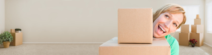 Image showing Banner of Happy Young Adult Woman Holding Moving Boxes In Empty 