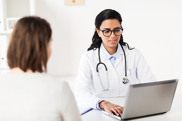 Image showing doctor with laptop and woman patient at hospital