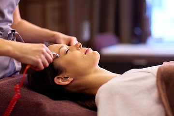 Image showing woman having hydradermie facial treatment in spa