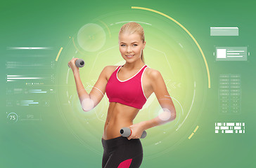 Image showing happy sporty woman with dumbbells flexing biceps