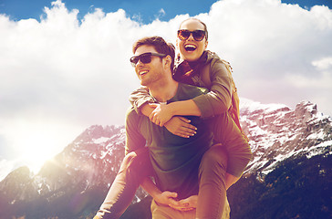 Image showing happy couple with backpacks traveling in highlands