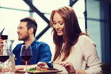 Image showing happy couple having dinner at restaurant