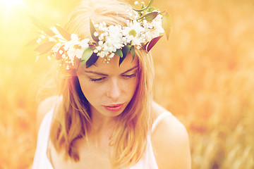 Image showing happy woman in wreath of flowers