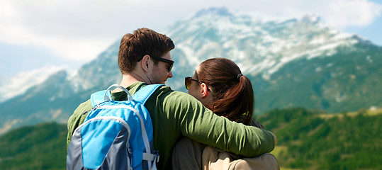 Image showing happy couple with backpacks traveling