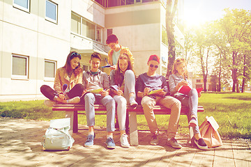 Image showing group of students with notebooks at school yard