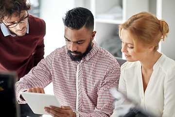 Image showing business team with tablet pc computer in office