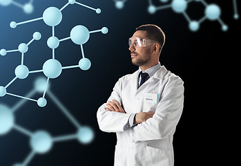 Image showing scientist in lab coat and goggles with molecules