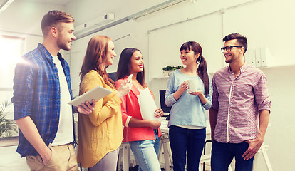 Image showing creative team on coffee break talking at office