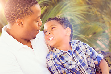 Image showing Mixed Race Son and African American Father Playing Outdoors Toge