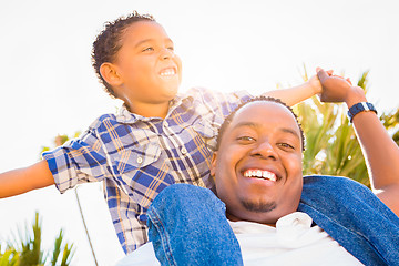 Image showing Mixed Race Son and African American Father Playing Piggyback Out