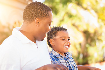 Image showing Mixed Race Son and African American Father Playing Outdoors Toge