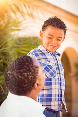 Image showing Mixed Race Son and African American Father Playing Outdoors Toge