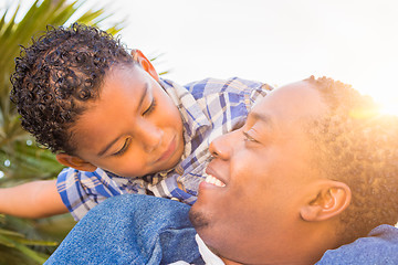 Image showing Mixed Race Son and African American Father Playing Piggyback Out