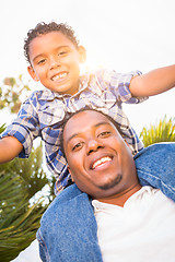 Image showing Mixed Race Son and African American Father Playing Piggyback Out