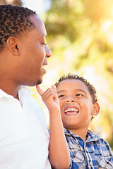 Image showing Mixed Race Son and African American Father Playing Outdoors Toge