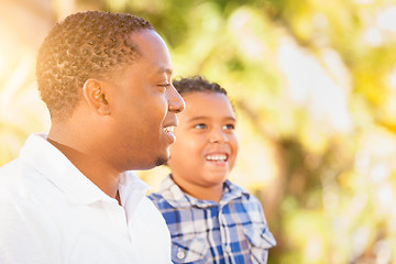 Image showing Mixed Race Son and African American Father Playing Outdoors Toge