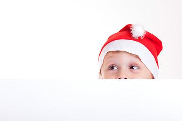 Image showing Happy little smiling boy with christmas hat.