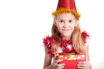 Image showing Happy little smiling girl with christmas gift box.