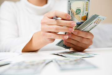 Image showing Hands counting money, close up