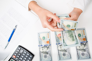 Image showing Hands counting money, close up