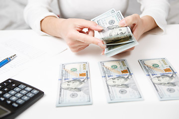 Image showing Hands counting money, close up