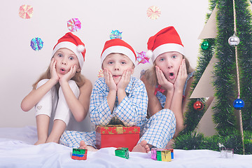 Image showing Happy little smiling boy and girls with christmas hat.