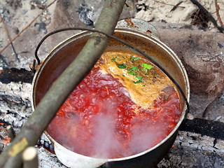 Image showing Borscht (Ukrainian traditional soup) cooking in sooty cauldron