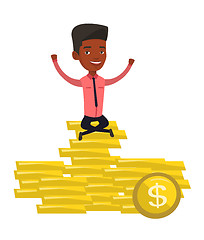 Image showing Happy businessman sitting on golden coins.