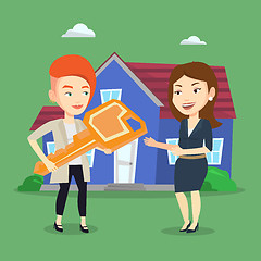 Image showing Real estate agent giving key to new house owner.