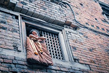 Image showing Child in window in Nepal