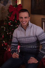 Image showing Happy young man with a glass of champagne