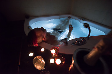 Image showing man relaxing in the jacuzzi