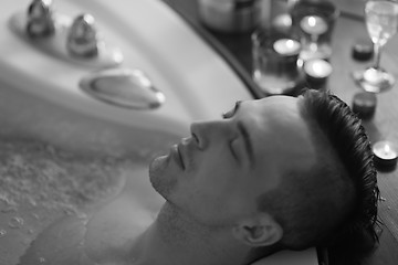 Image showing man relaxing in the jacuzzi