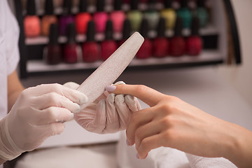 Image showing Woman hands receiving a manicure