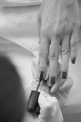 Image showing Woman hands receiving a manicure