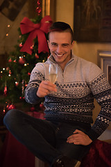 Image showing Happy young man with a glass of champagne