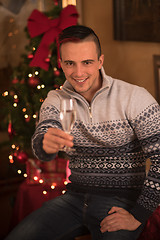 Image showing Happy young man with a glass of champagne