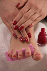 Image showing female feet and hands at spa salon