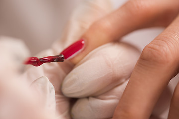 Image showing Woman hands receiving a manicure