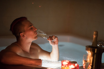 Image showing man relaxing in the jacuzzi