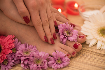 Image showing female feet and hands at spa salon