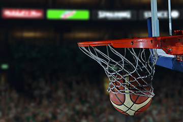 Image showing basketball ball and net on black background