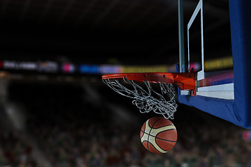 Image showing basketball ball and net on black background