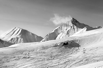 Image showing Black and white view on ski slope at winter evening