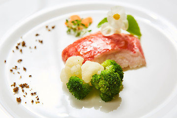 Image showing The red snapper with vegetable. Shallow dof.