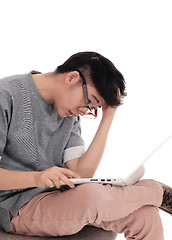 Image showing Asian man working at laptop.