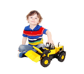 Image showing Three year old boy with his toy.